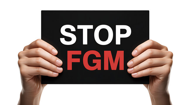 Hands Holding a Black Sign with Stop FGM Message for Global Awareness Human Rights and Women Protection Activism