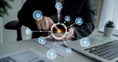 A focused business professional engages with a mobile device in a modern workspace, while technology icons illustrate vibrant digital communications and networking possibilities. Crux