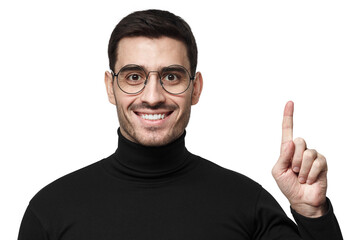 Cheerful businessman pointing finger up showing idea or solution in black turtleneck with glasses