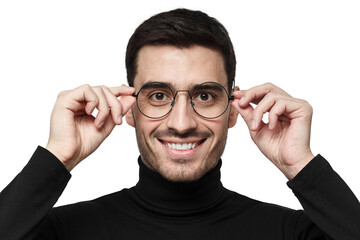 Happy man adjusting glasses with both hands smiling in black turtleneck closeup portrait