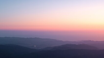 Obraz premium A serene mountain landscape at sunset with a vibrant sky