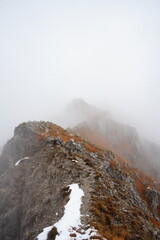 snow-capped mountain ridge among the clouds, Italy