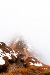 snow-capped mountain ridge among the clouds, Italy