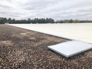 TPO and Ballast type roofing with a skylight © bybarn