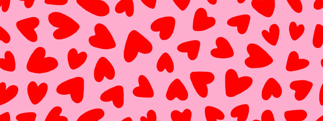 Seamless background pattern with messy red hearts in primitive hand drawn style on pink backdrop, for holiday wrapping paper and textile design, vector illustration.