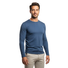 Fototapeta premium A man standing in a studio wearing a blue long-sleeved shirt and khaki pants