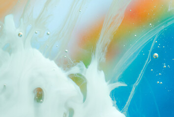 Vibrant macro abstract of multicolor liquid with dynamic flow and contrast. Ideal for creative backgrounds, digital art, branding, advertising, and expressive visual projects. Copy space