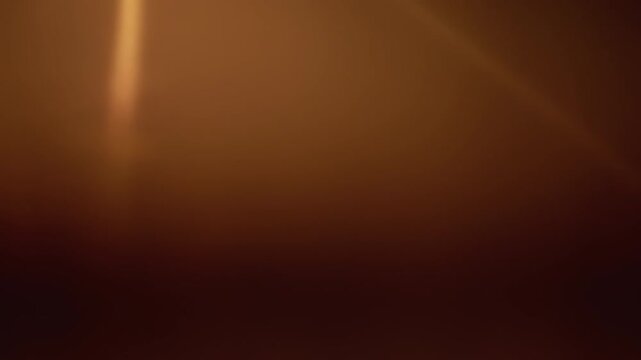Foggy streetlight emits warm orange glow with soft halo and lens flare, out of focus bokeh and misty atmosphere, empty urban pole and bulb drifting in nocturnal haze, minimal cinematic solitude