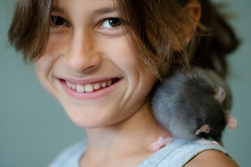 A girl and her small pet in a happy moment showcasing the joy and warmth capturing the essence of...