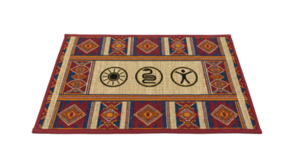 Rectangular woven reed mat with ethnic geometric patterns and three black symbols representing the sun, a snake, and a human, showcasing traditional artisanal craftsmanship