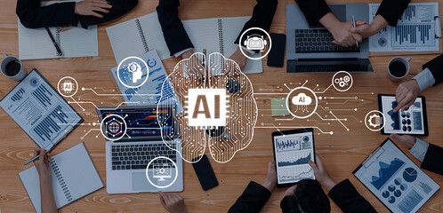 A modern workspace showcasing multiple digital devices with artificial intelligence graphics, highlighting teamwork, data analytics, and business innovation in a collaborative environment. Trope