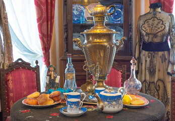 Tea table with porcelain dishes and samovar