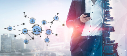 A business professional interacts with a smartphone, surrounded by a futuristic technology network in a vibrant city setting, showcasing modern connectivity and innovation. Tessel