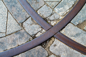 Ancient flagtone road with iron detail