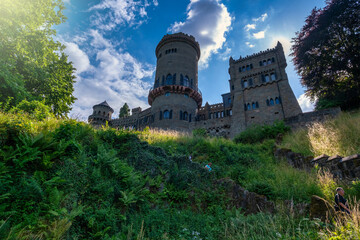 Historic Stone Entrance, Worn Brick Entrance To Heritage Castle Surrounded By Natural Shade And Light