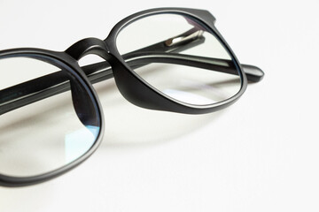 Eye protection glasses for computer work, black frame with clear lenses on a white background, accessory for office, vision
