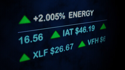 Close-up of a digital stock market display showing increasing energy sector prices and various financial data with green up arrows