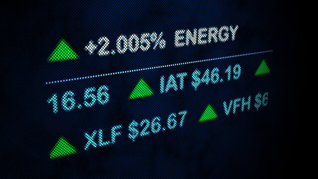 Close-up of a digital stock market display showing increasing energy sector prices and various financial data with green up arrows - Powered by Adobe
