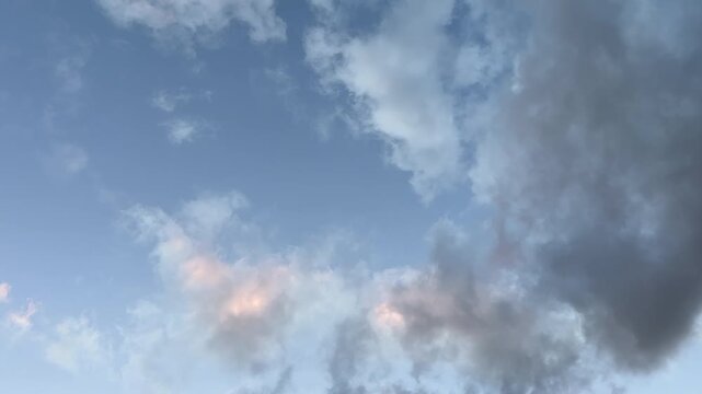 Moving cumulus cloud against idyllic blue sky, low angle view 