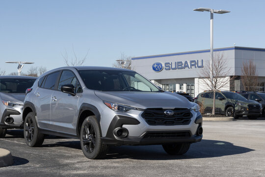 Subaru Crosstrek AWD Compact SUV display at a dealership. Subaru offers the Crosstrek with a 2.5L DOHC BOXER engine. MY:2026