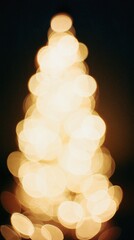 blurred christmas tree lights bokeh on dark background