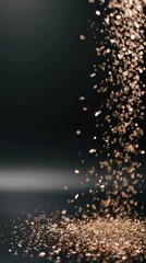 falling golden glitter on a dark background