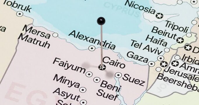 A zoom out of a black pin into cairo city of egypt political map