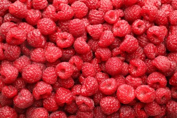 Fresh ripe raspberries as background, top view