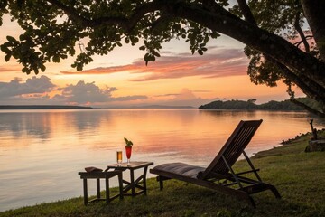 Sunset View From a Lounge Chair by the River With Drinks on the Table