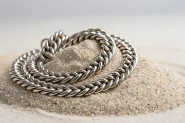 Metal Chains Placed on Light-Colored Sand at a Beach During Daylight Hours