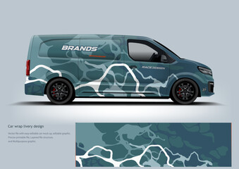 A cool-toned teal abstract wrap with fluid shapes that give a modern and artistic automotive appearance.