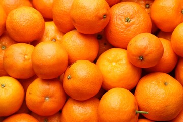 Many fresh ripe tangerines as background, top view
