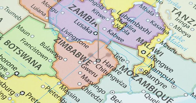 A zoom out of a white pin into harare city of zimbabwe political map