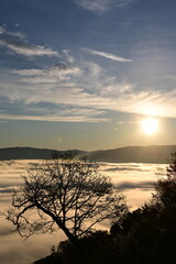 Fototapeta premium Stunning sunrise from a mountain top over the clouds