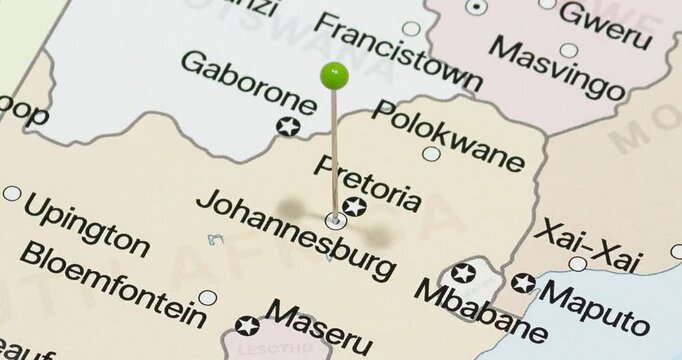 A zoom out of a green pin into johannesburg city of south africa political map