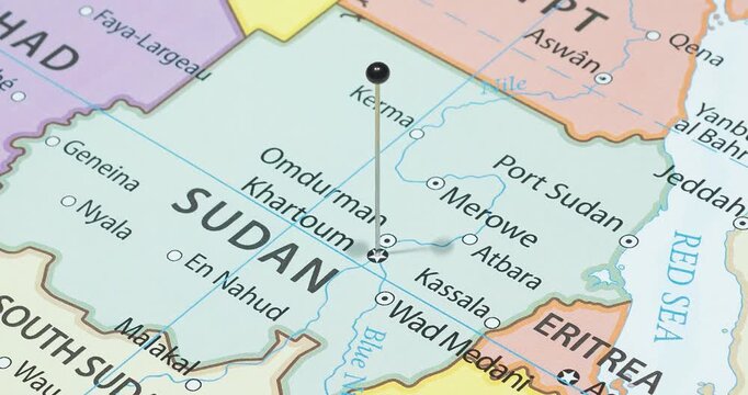 A zoom out of a black pin into khartoum city of sudan political map