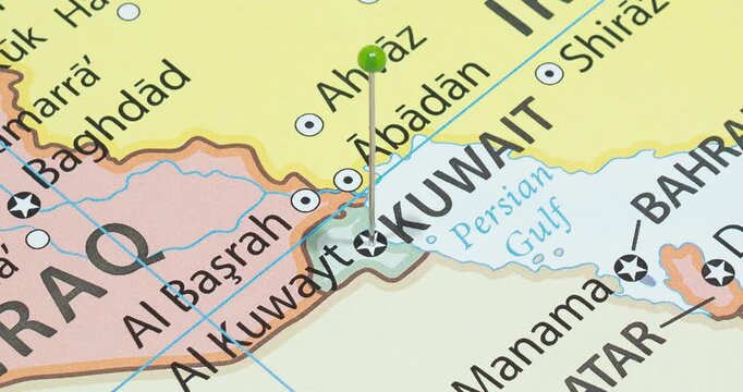 A zoom out of a green pin into kuwait city of kuwait political map