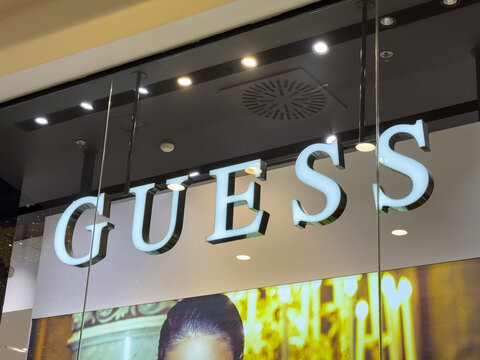 Zagreb, Croatia - December 17, 2025: GUESS brand logo displayed prominently in a modern retail store, showcasing stylish fashion and contemporary design elements in a vibrant shopping environment