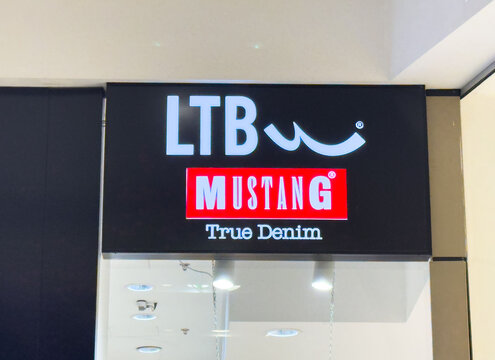 Zagreb, Croatia - December 17, 2025: LTB Mustang store sign showcasing True Denim branding in a modern retail environment with bright lighting and sleek design elements