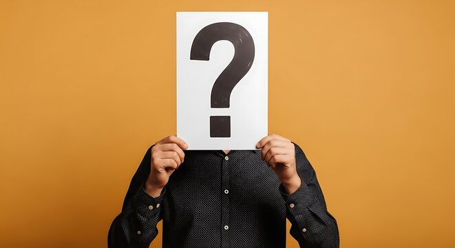 Person holding a question mark sign in front of their face.