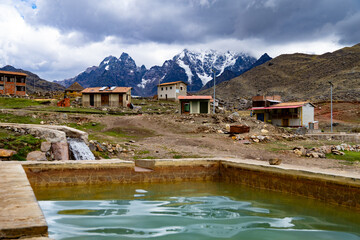 Pacchanta hot springs with a view of the Ausangate snow-capped mountain, Cusco, Peru