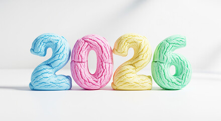 Colorful marshmallow numbers spelling out the year 2026 on a white background with soft lighting