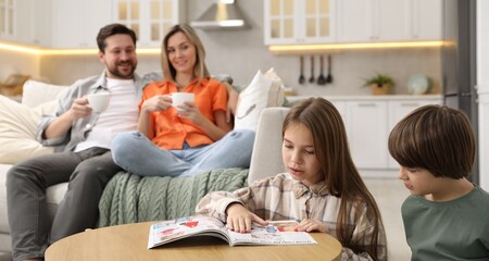 Happy family spending time together in kitchen at home, selective focus