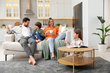 Fototapeta premium Happy family spending time together in kitchen at home