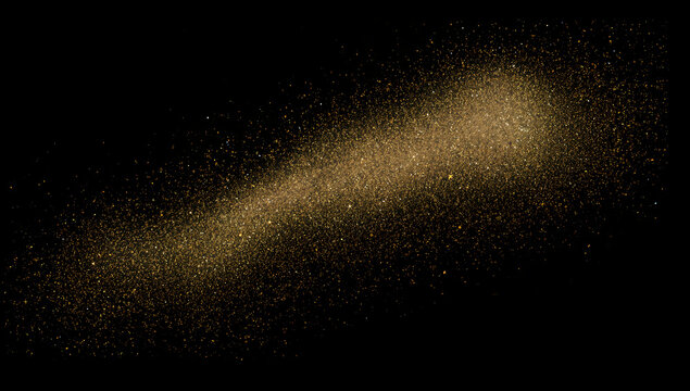 Explosion of golden glitter particles against black background