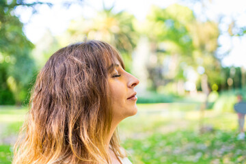 Profile portrait of a woman with her eyes closed © Carbonero Stock