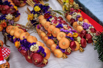 Braided onions with flowers for Zibelemarit festival in Bremgarten, Switzerland