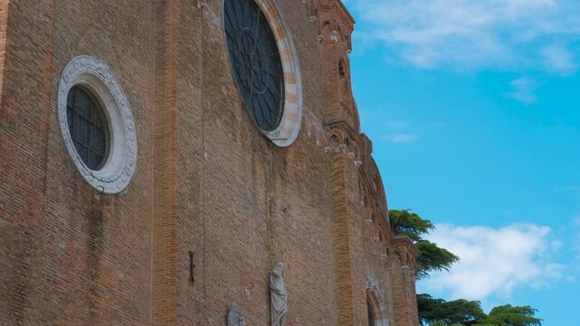 Basilica di santa maria gloriosa dei frari showing architectural details. Architectural details of the basilica di santa maria gloriosa dei frari in venice, italy, featuring its facade, rose window