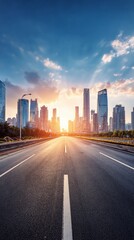 Obraz premium Sunrise illuminates an empty highway leading towards a modern cityscape with towering skyscrapers, creating a dramatic perspective of urban infrastructure and architectural grandeur