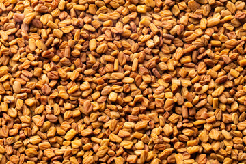 Heap of natural aromatic fenugreek seeds - Healthy food